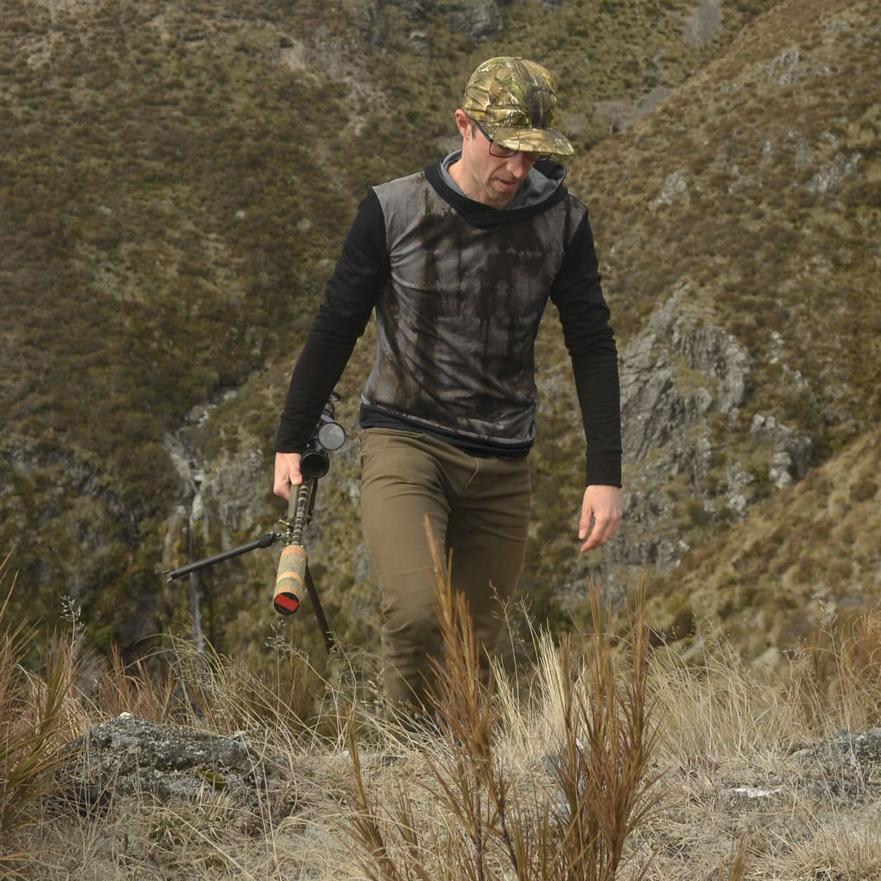 Wild Balance men’s Rangitata hoodie walking view in Greywacke and Black Dye.